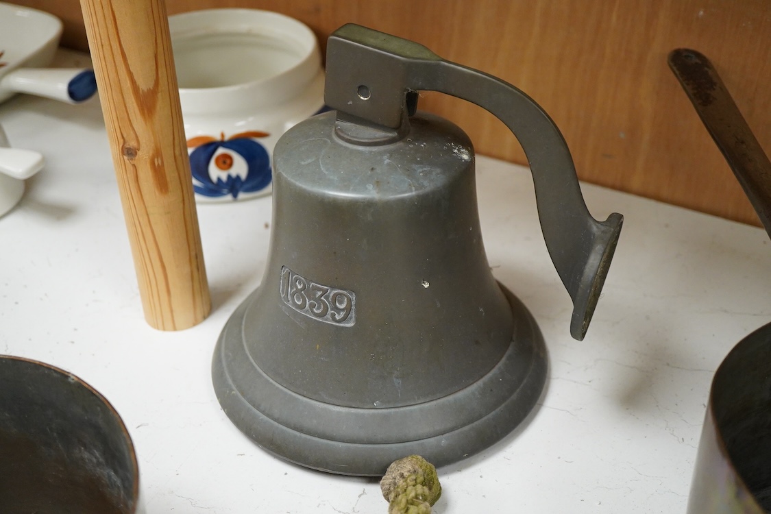 A bronze bell dated 1839 and two Victorian copper and brass saucepans